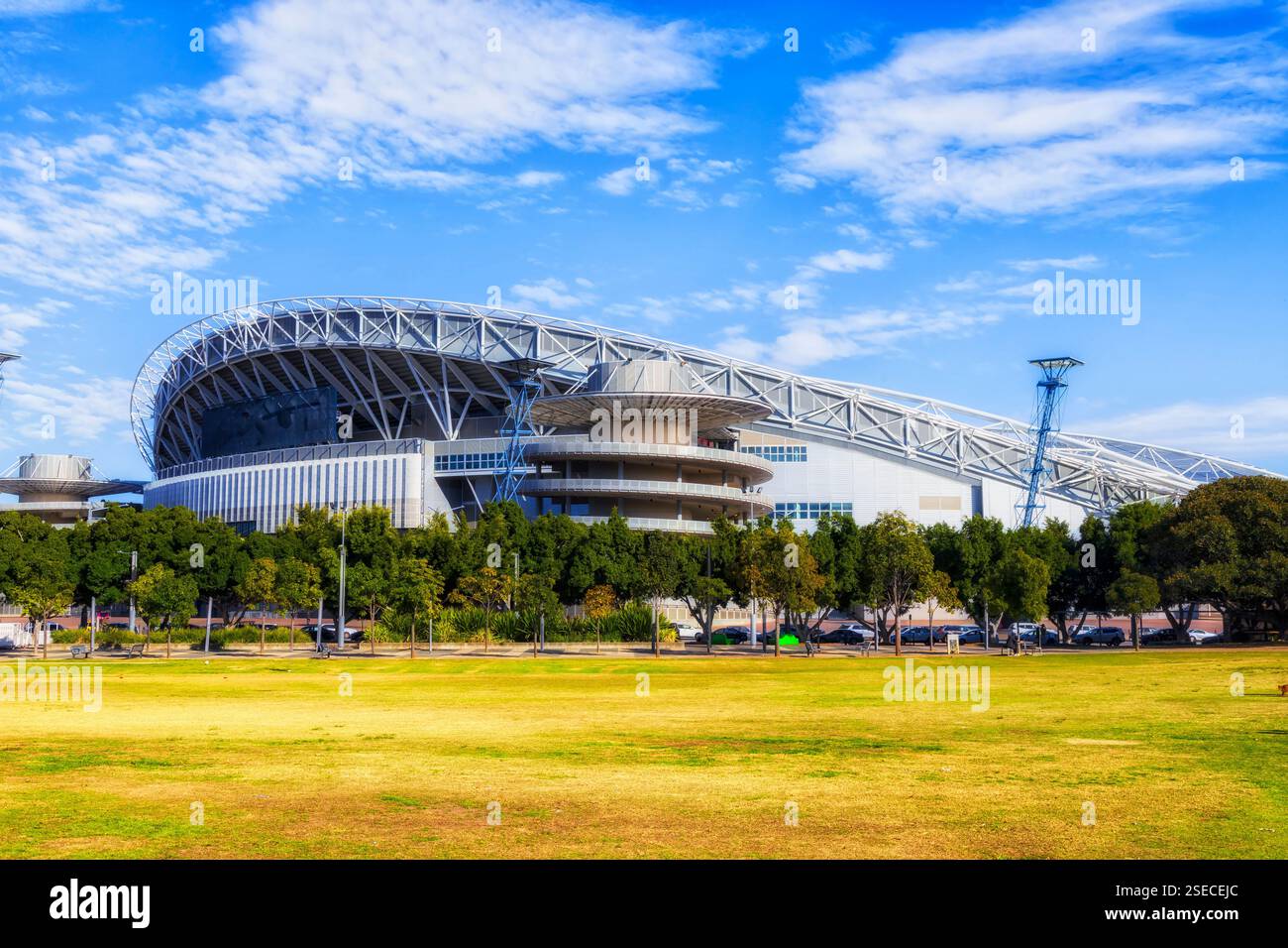 Green lawns of Sydney Olympic park in Australia - popular sports and entertainment disctrict infrastructure. Stock Photo