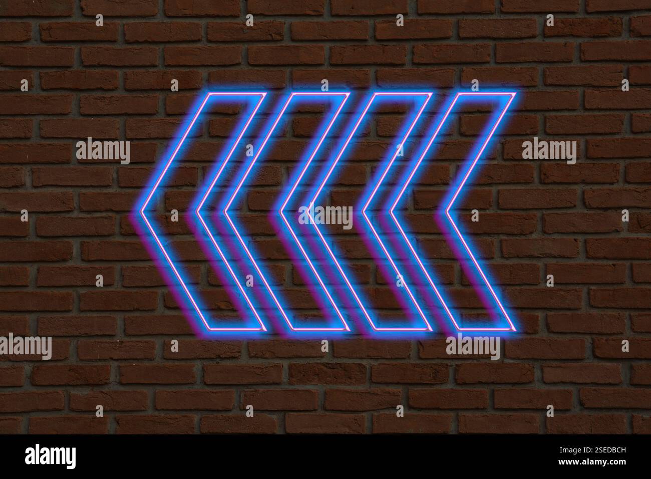 Bright neon arrow-shaped pointer on brick wall Stock Photo