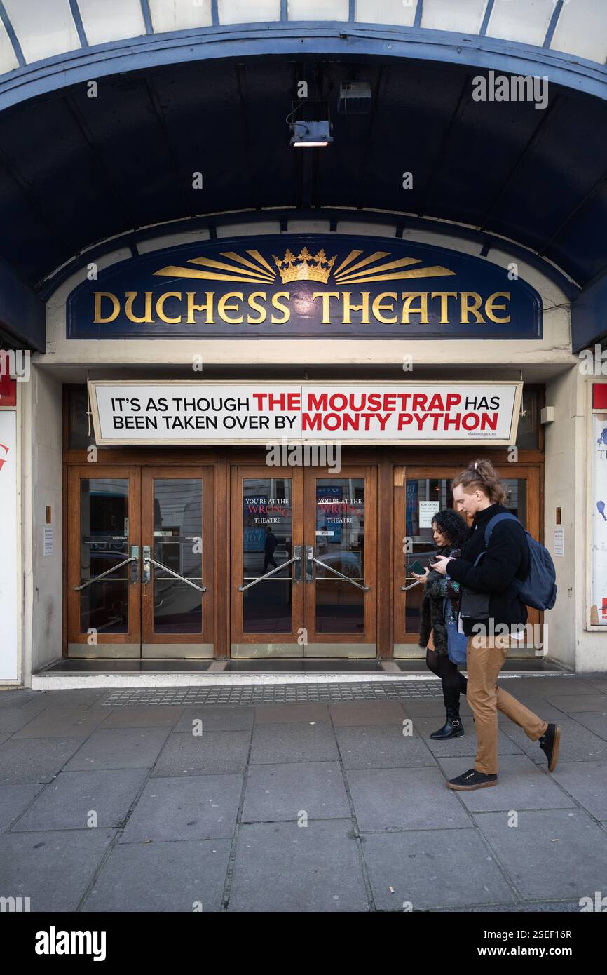 Pedestrians outside the Duchess Theatre in London, a playbill ...