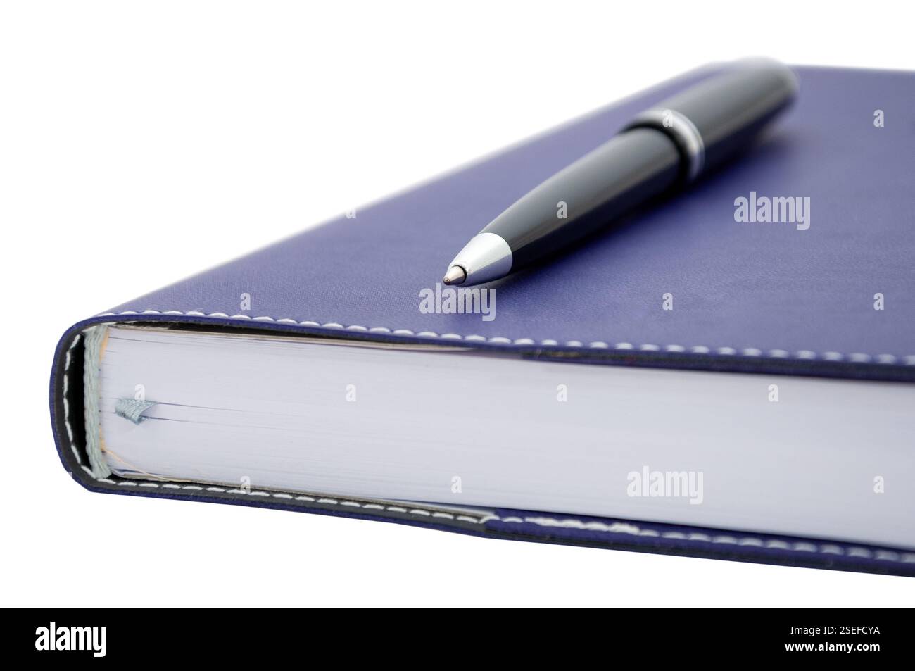 ballpoint pen is laying on paper notebook Stock Photo