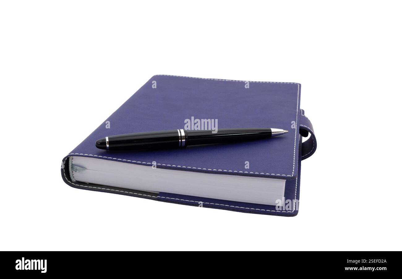 ballpoint pen is laying on paper notebook Stock Photo