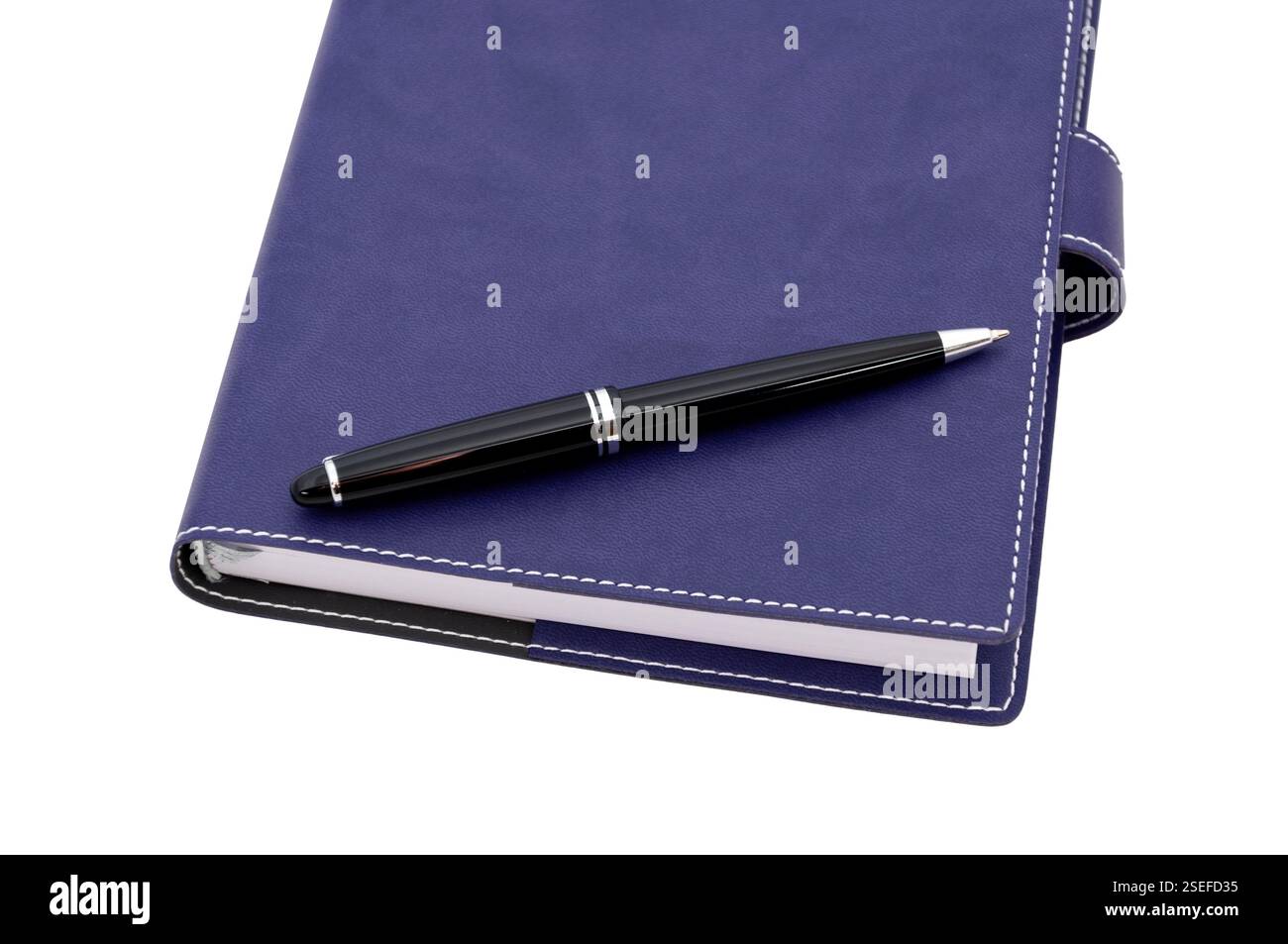 ballpoint pen is laying on paper notebook Stock Photo