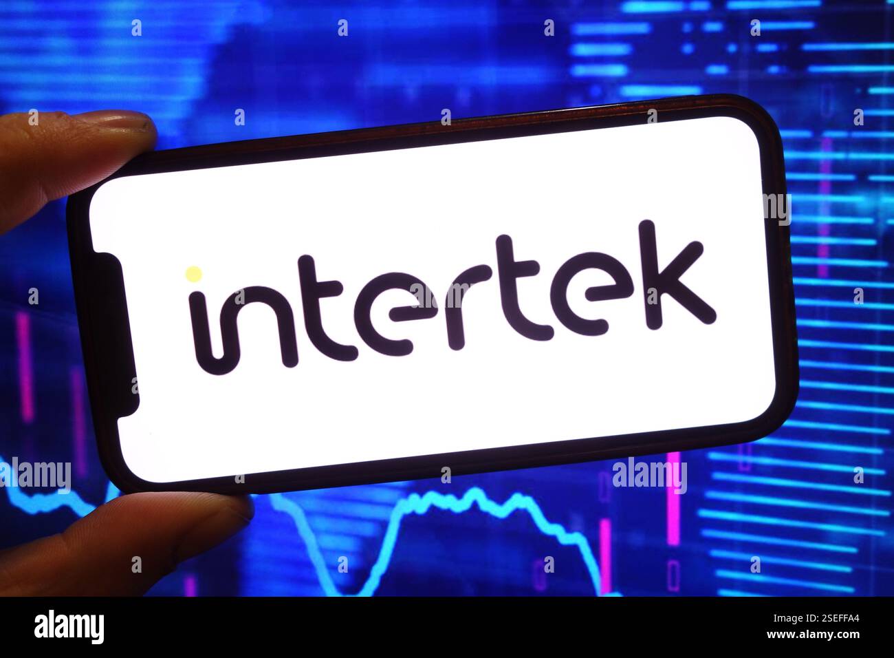 In this photo illustration, the Intertek company logo is seen displayed ...