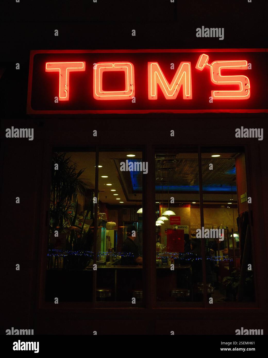Toms Restaurant vintage neon sign at night in Morningside Heights, Manhattan, New York City Stock Photo