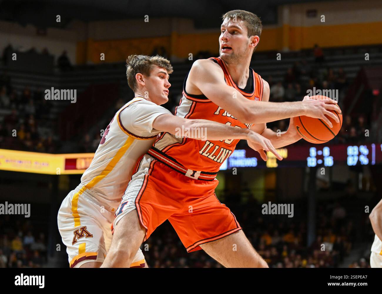 Minnesota guard Brennan Rigsby, left, tries to knock the ball away from ...