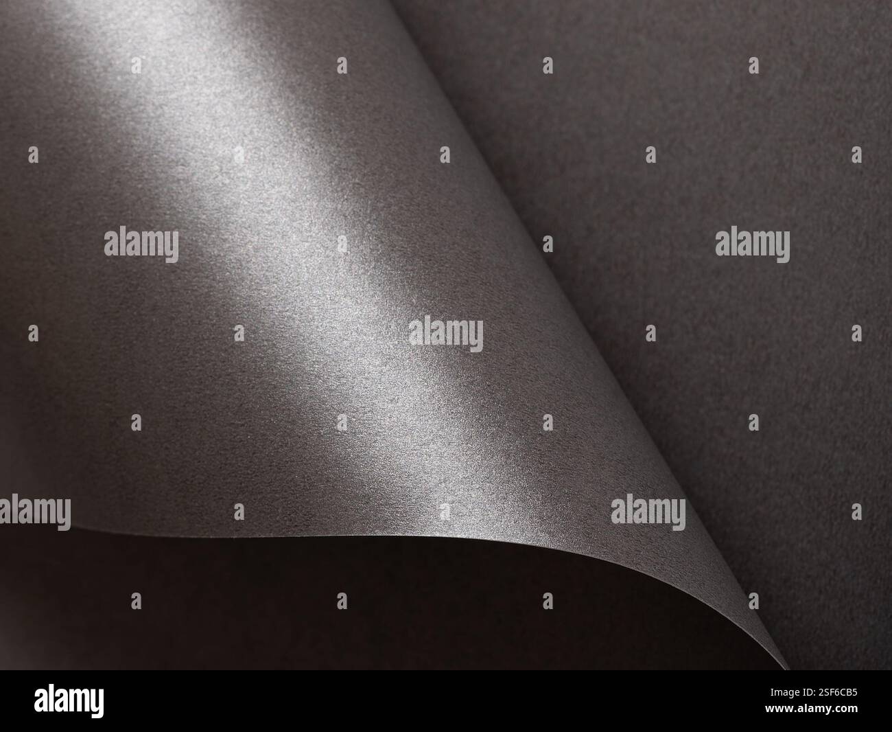 Dark graphite paper texture with a smooth, monochrome gradient and elegant finish. Blank artistic surface featuring a rich, vintage-inspired pattern w Stock Photo