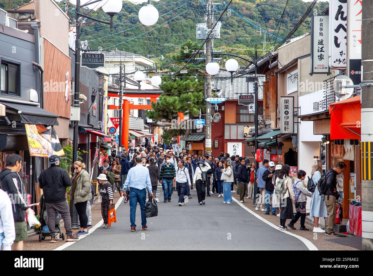 Busy street with people, shops and restaurants in Fushimi, Kyoto Stock ...