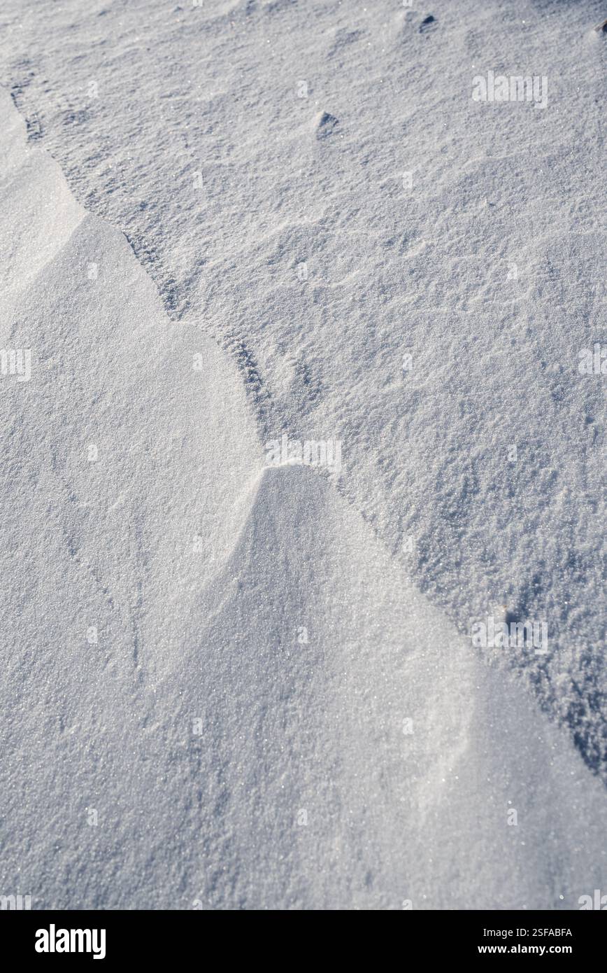 Shapes, textures, patterns created by snow and wind. Stock Photo