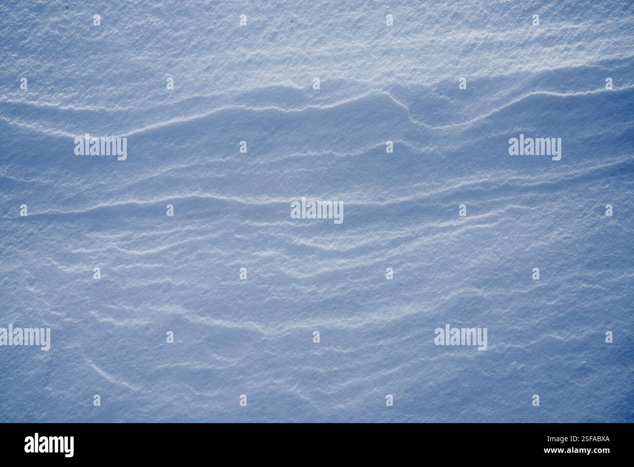 Shapes, textures, patterns created by snow and wind. Stock Photo
