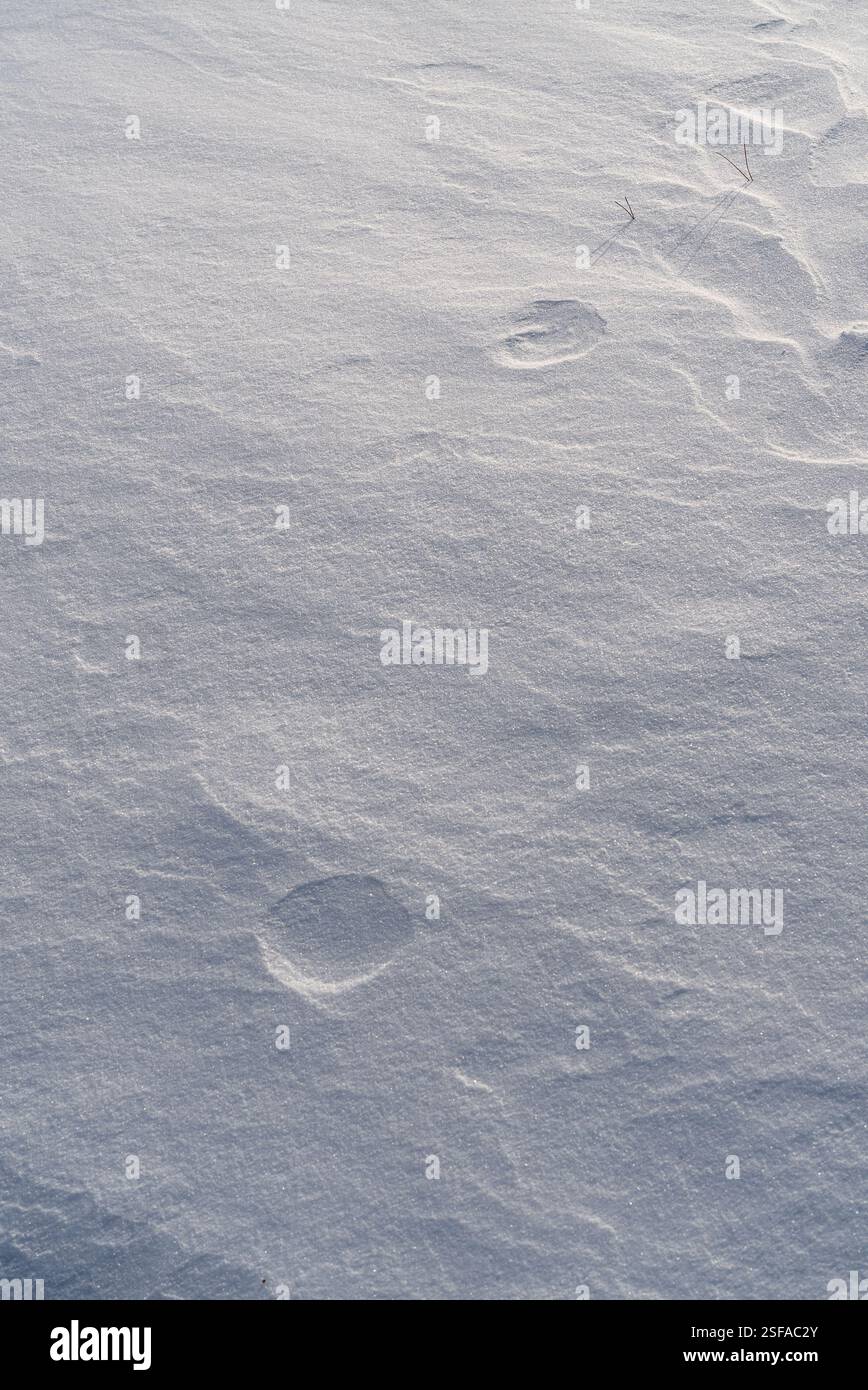 Shapes, textures, patterns created by snow and wind. Stock Photo