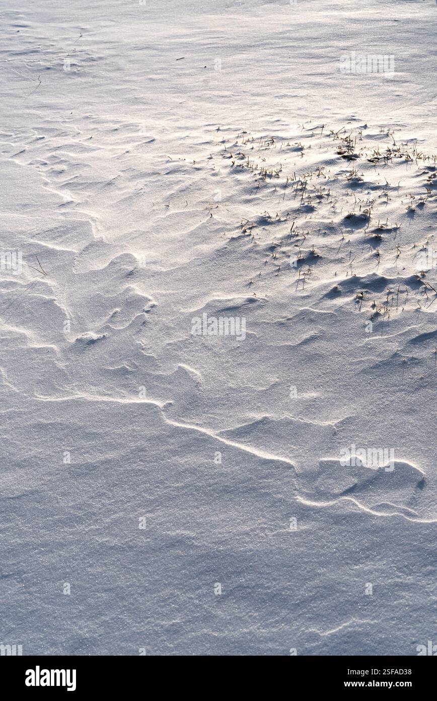 Shapes, textures, patterns created by snow and wind. Stock Photo