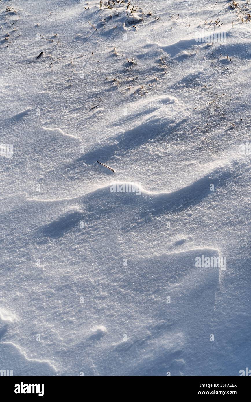 Shapes, textures, patterns created by snow and wind. Stock Photo