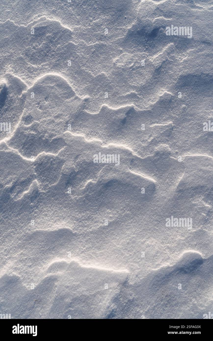 Shapes, textures, patterns created by snow and wind. Stock Photo