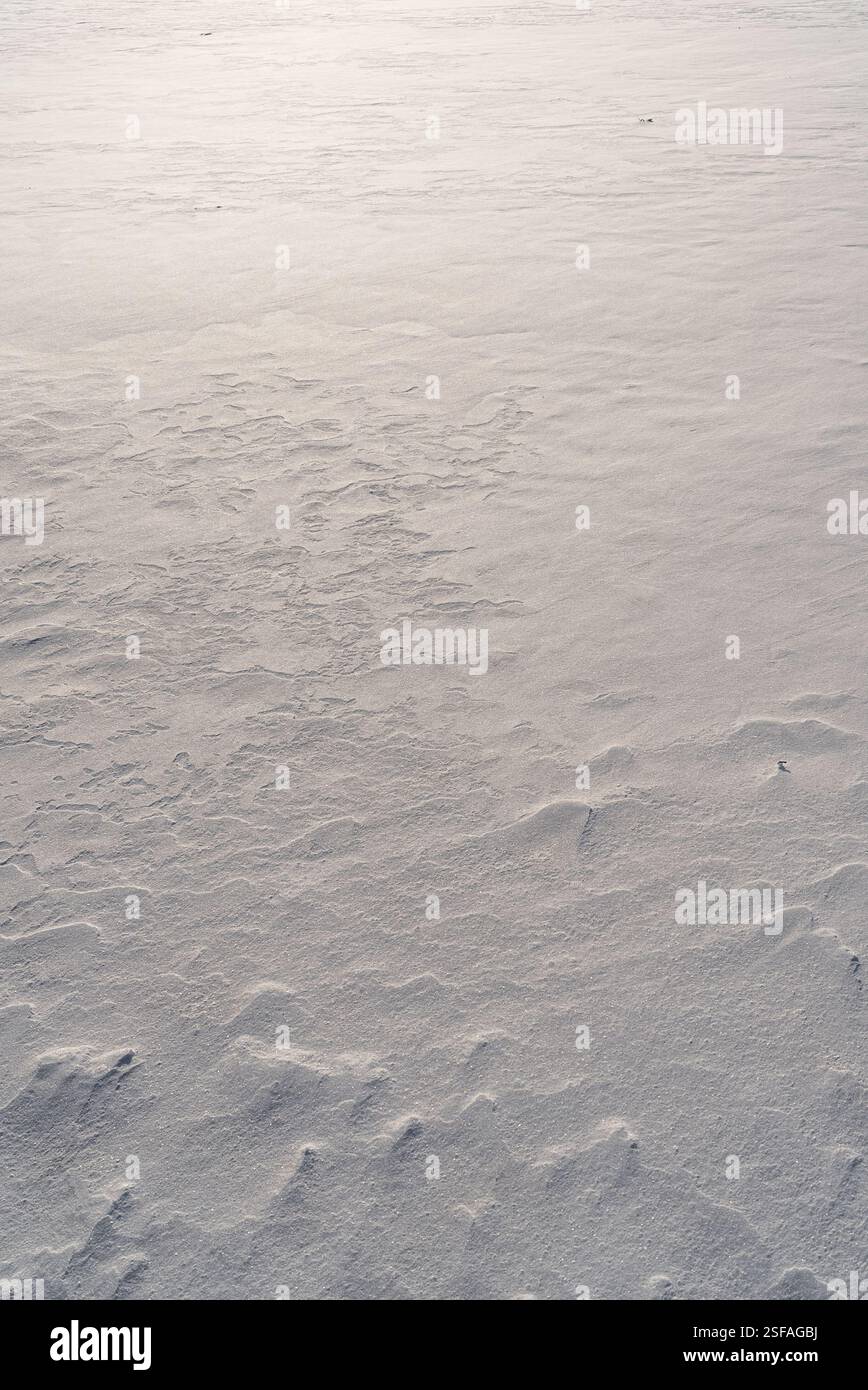 Shapes, textures, patterns created by snow and wind. Stock Photo