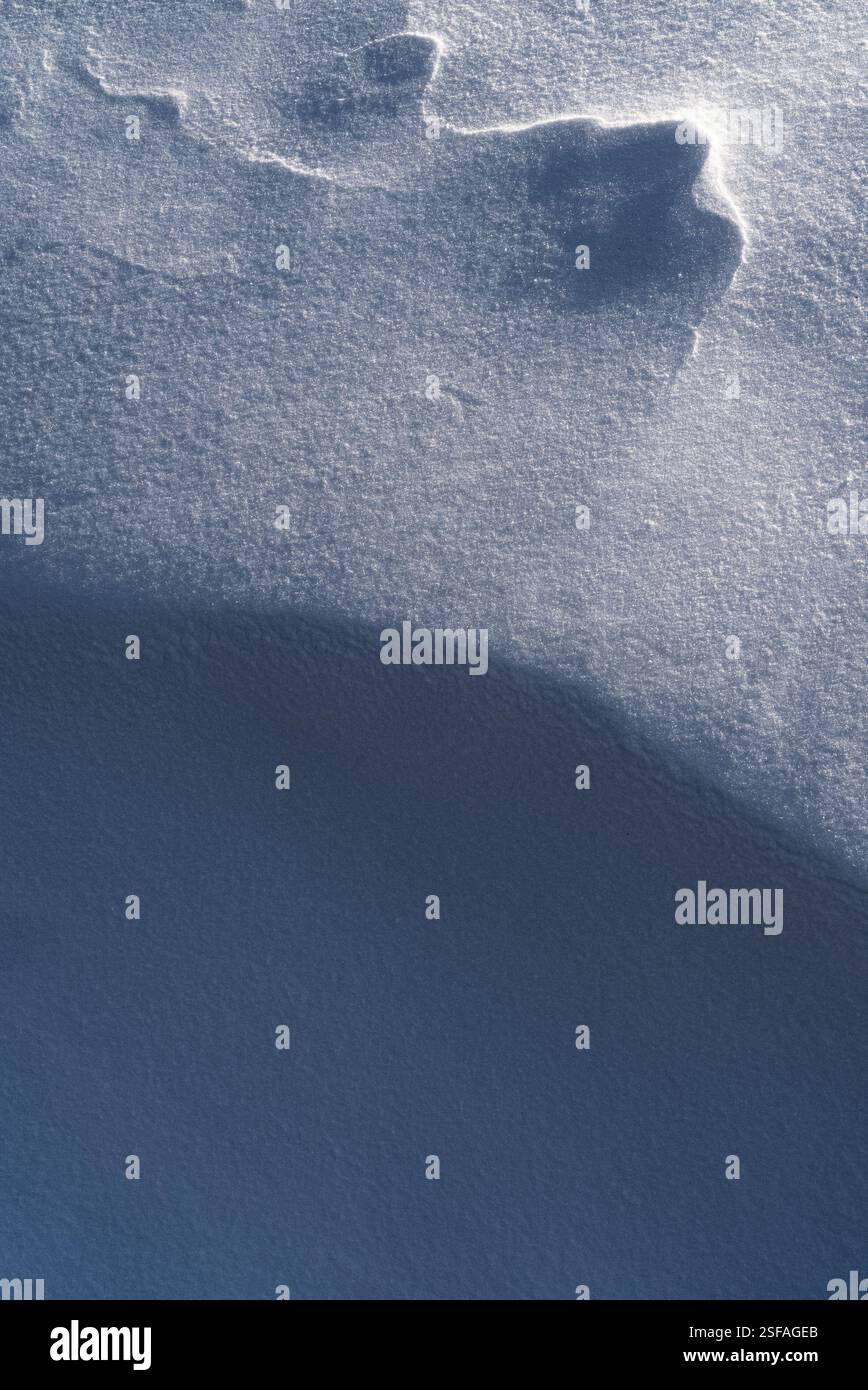 Snow texture, pattern. Light and shadow. Stock Photo