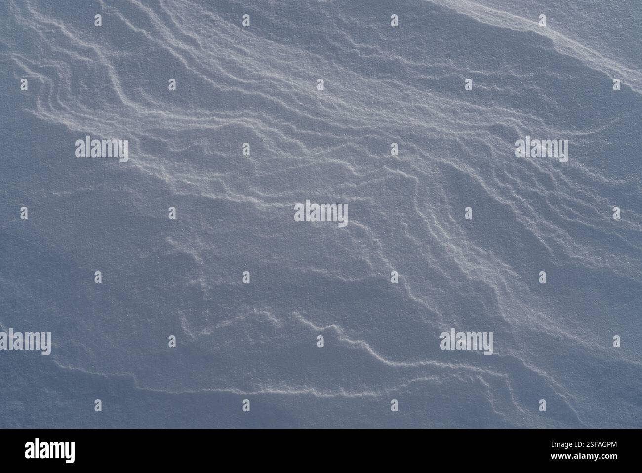 Shapes, textures, patterns created by snow and wind. Stock Photo
