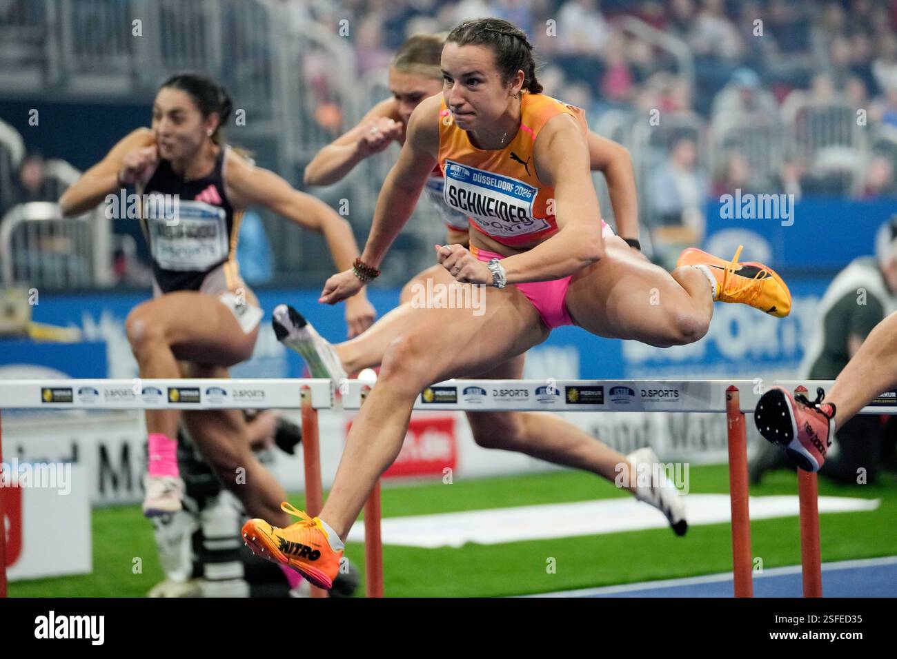 Rosina schneider of germany goes on to win the womens hurdles during the istaf athletics indoor meeting in duesseldorf german Rosina schneider of germany goes on to win the womens hurdles during the istaf athletics indoor meeting in duesseldorf german
