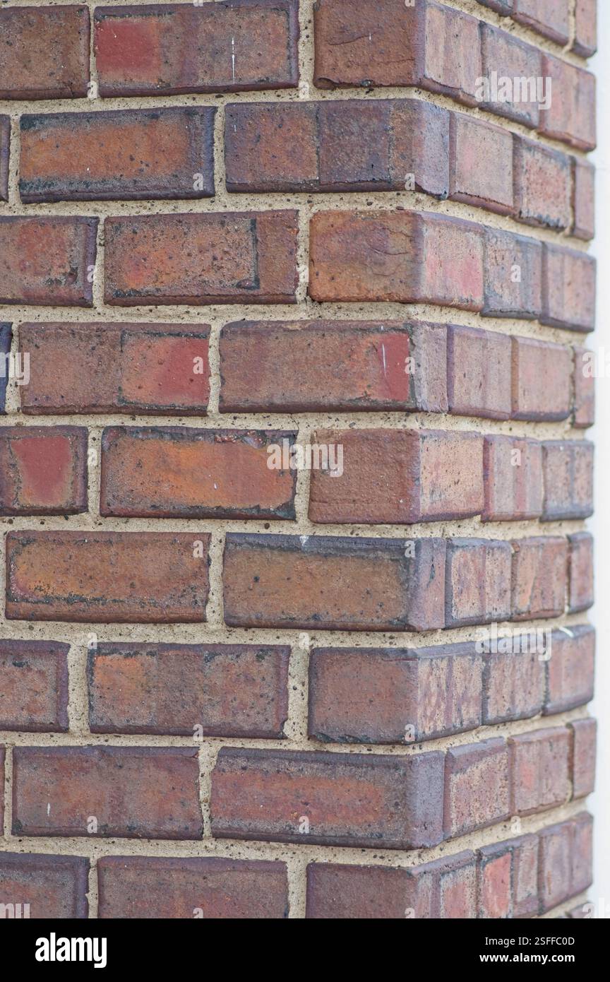 Weathered brick on a building corner Stock Photo