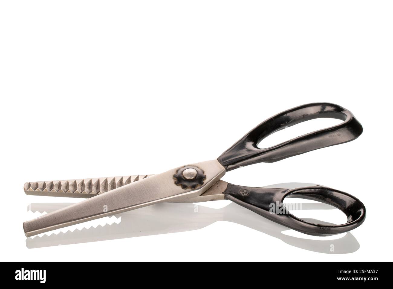 One tailor's scissors, close-up, isolated on a white background. Stock Photo