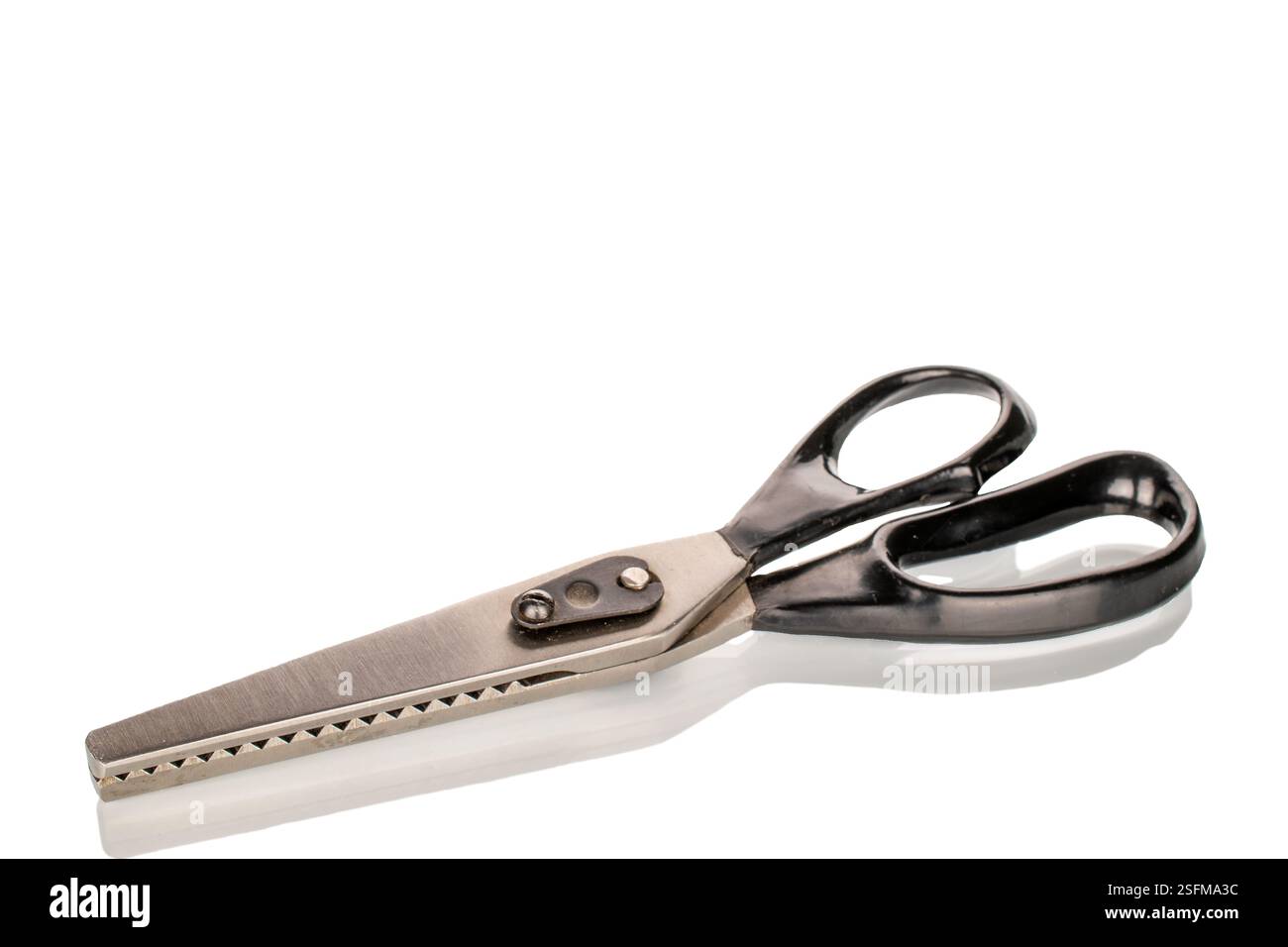 One tailor's scissors, close-up, isolated on a white background. Stock Photo
