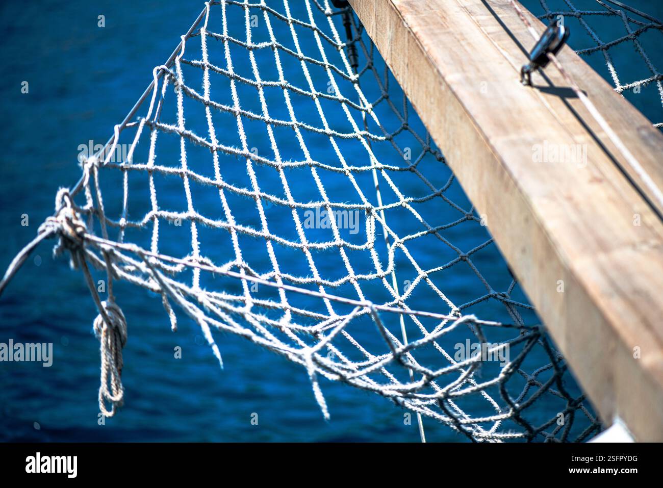 A close-up view of a strong rope net stretched over the bow (pruva) of ...