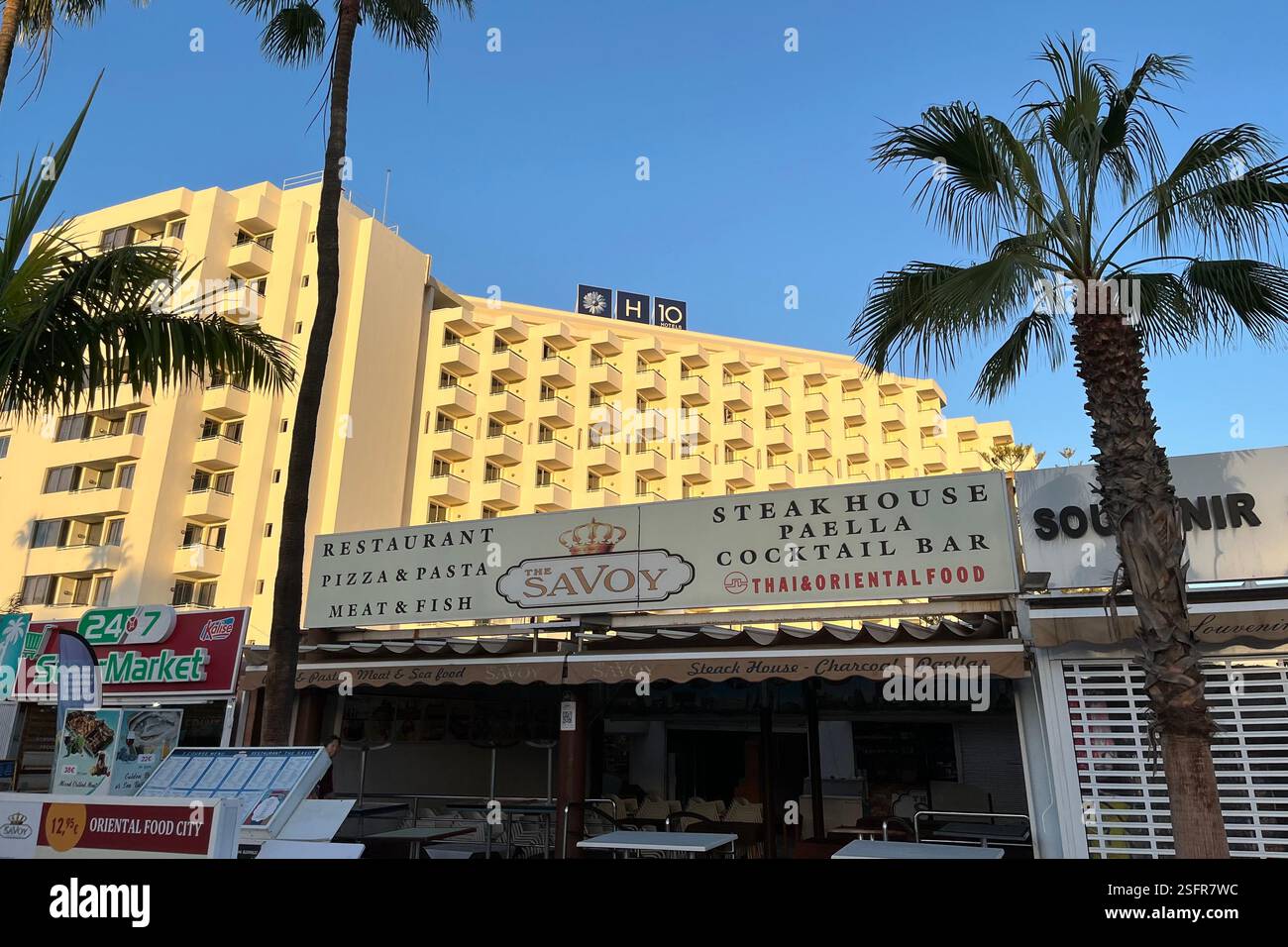 Shops and Restaurants in front of the H10 Las Palmeras Hotel in Playa de las Américas. Arona. Tenerife, Canary Islands, Spain. 15th January 2025. - Smartphone Captured Stock Image