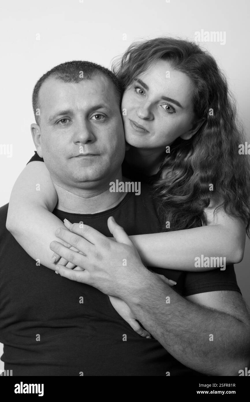 Couple shares an intimate embrace, conveying love and connection Stock Photo