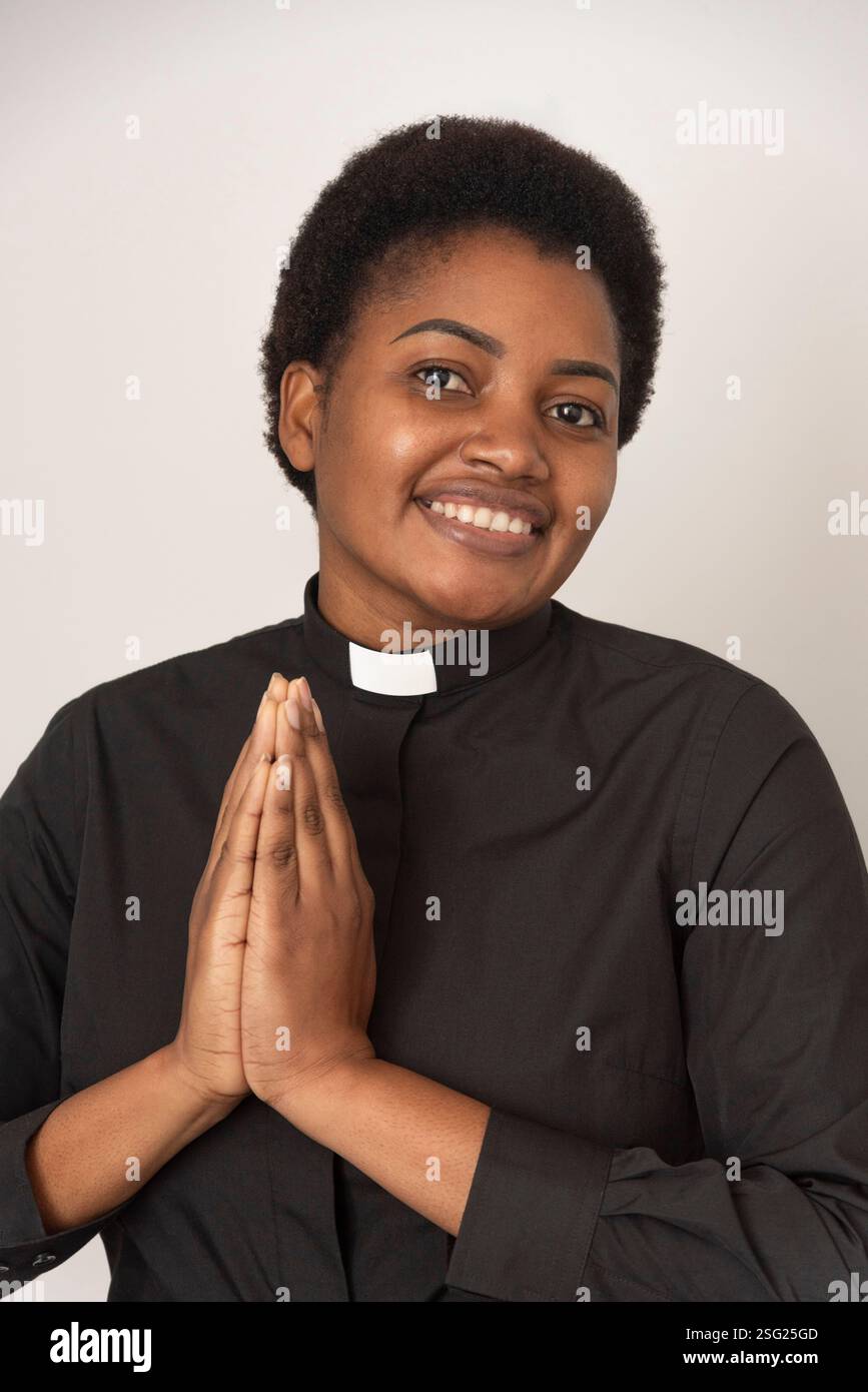 England United Kingdom. 26.01.2025. A portrait of an African woman wearing a white ecclesiastcal collar and black shirt. Stock Photo