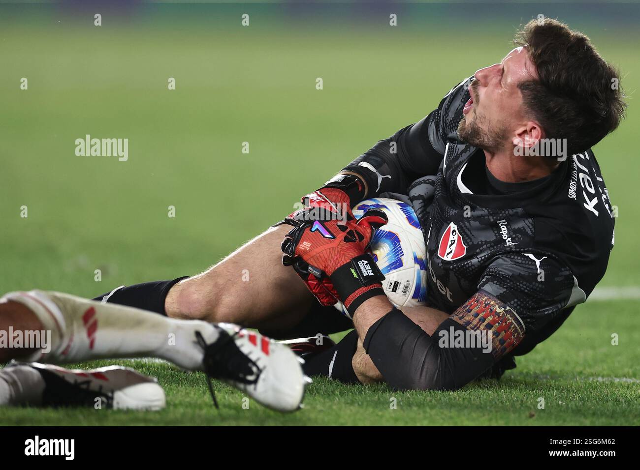 Independiente's goalkeeper Rodrigo Rey gestures in pain during the 2025 ...