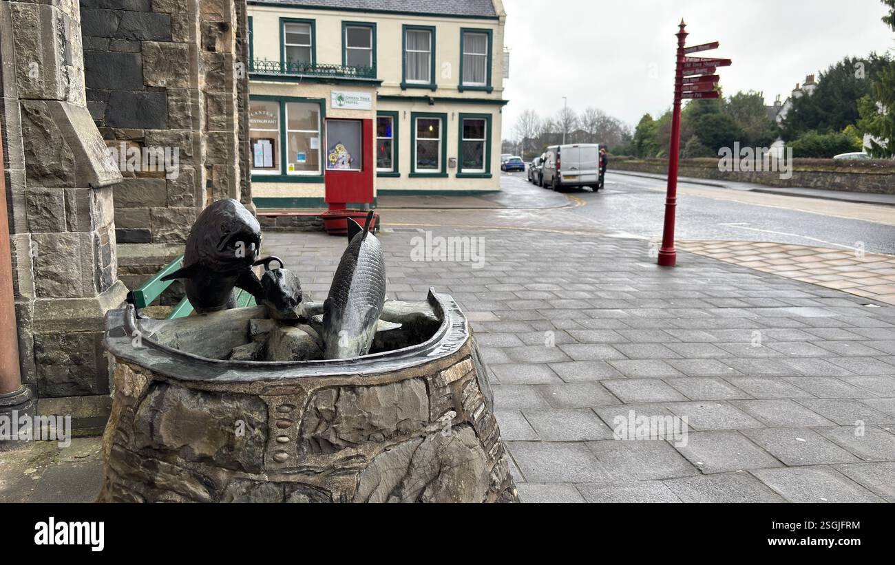 Fish Sculpture outside Eastgate Theatre in Peebles, Scottish Borders. Beautiful old village town in the Borders area of Scotland. Historic buildings - Smartphone Captured Stock Image