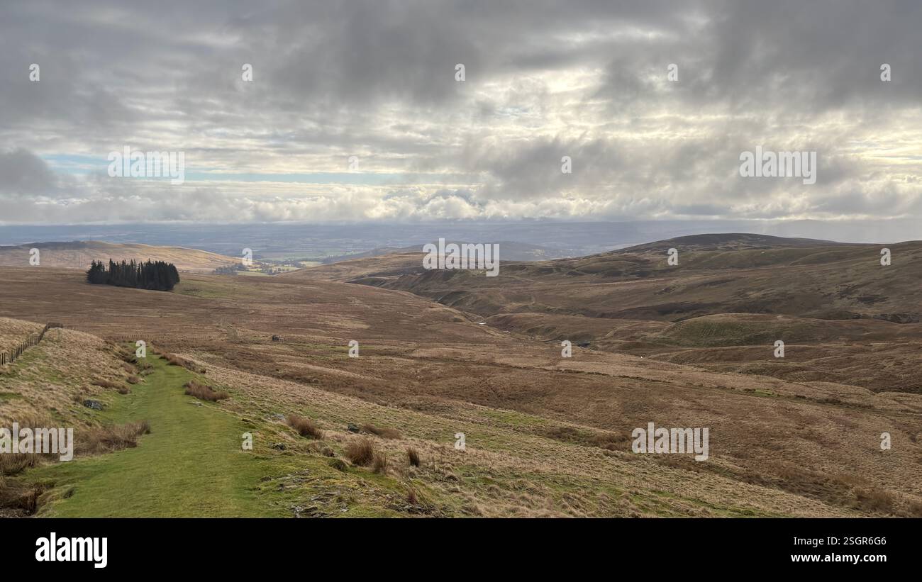 Scottish Highland mountains in winter with snow. Rolling hills in the outdoors in Scotland. Wild nature view across beautiful countryside - Smartphone Captured Stock Image