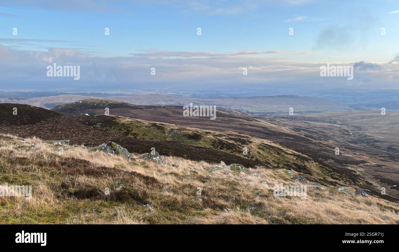 Scottish Highland mountains in winter with snow. Rolling hills in the outdoors in Scotland. Wild nature view across beautiful countryside - Smartphone Captured Stock Image