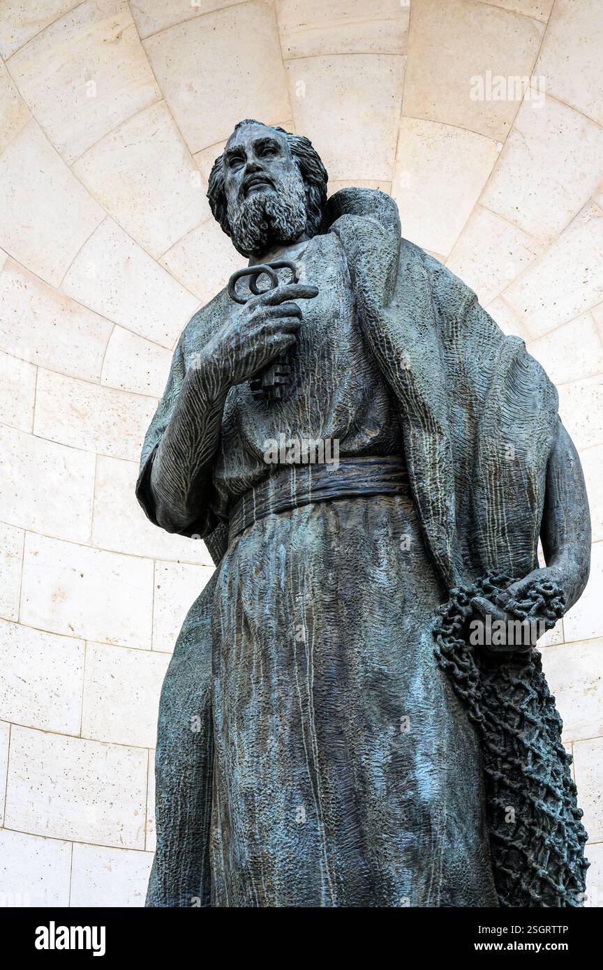 Metal statue of St. Peter in the facade of the Almudena Cathedral. Madrid, Spain. Stock Photo
