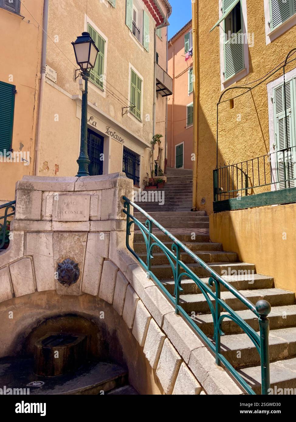 Colorful stairs lead the way through a picturesque European village - Smartphone Captured Stock Image