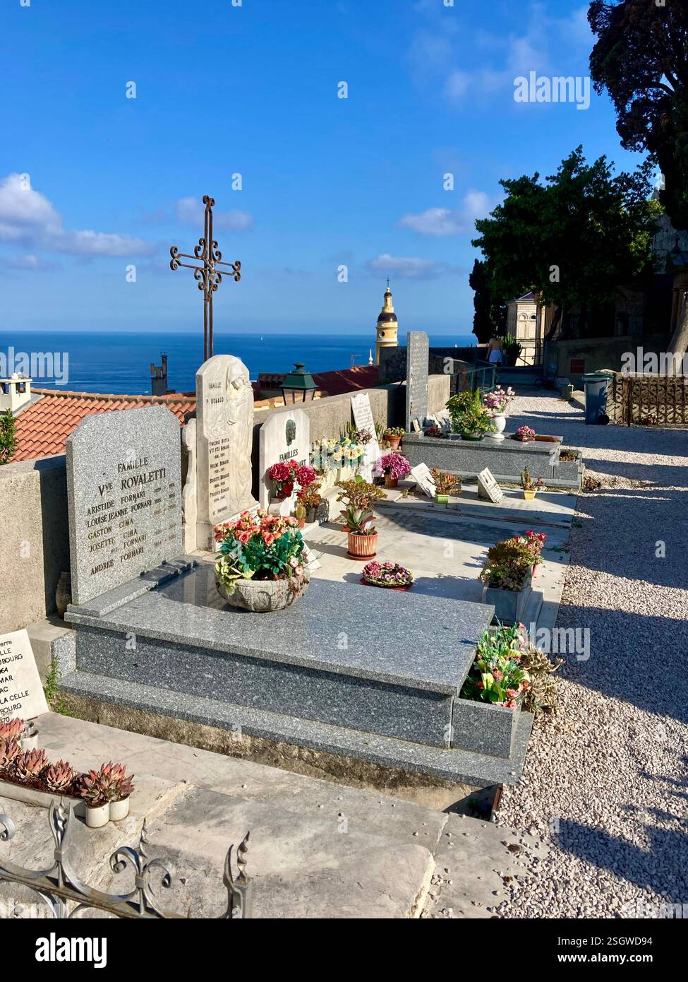 A peaceful resting place where the sea whispers its eternal song, offering solace and serenity to those who rest here - Smartphone Captured Stock Image