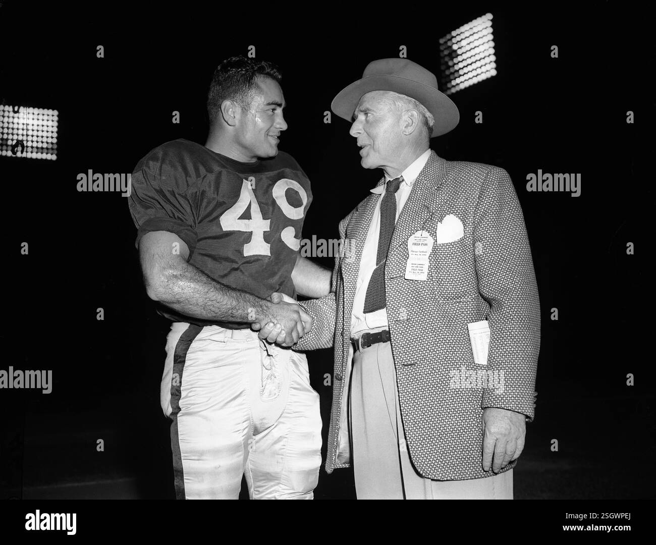 Al Pollard, left, shakes hands with New York Yankees football team ...