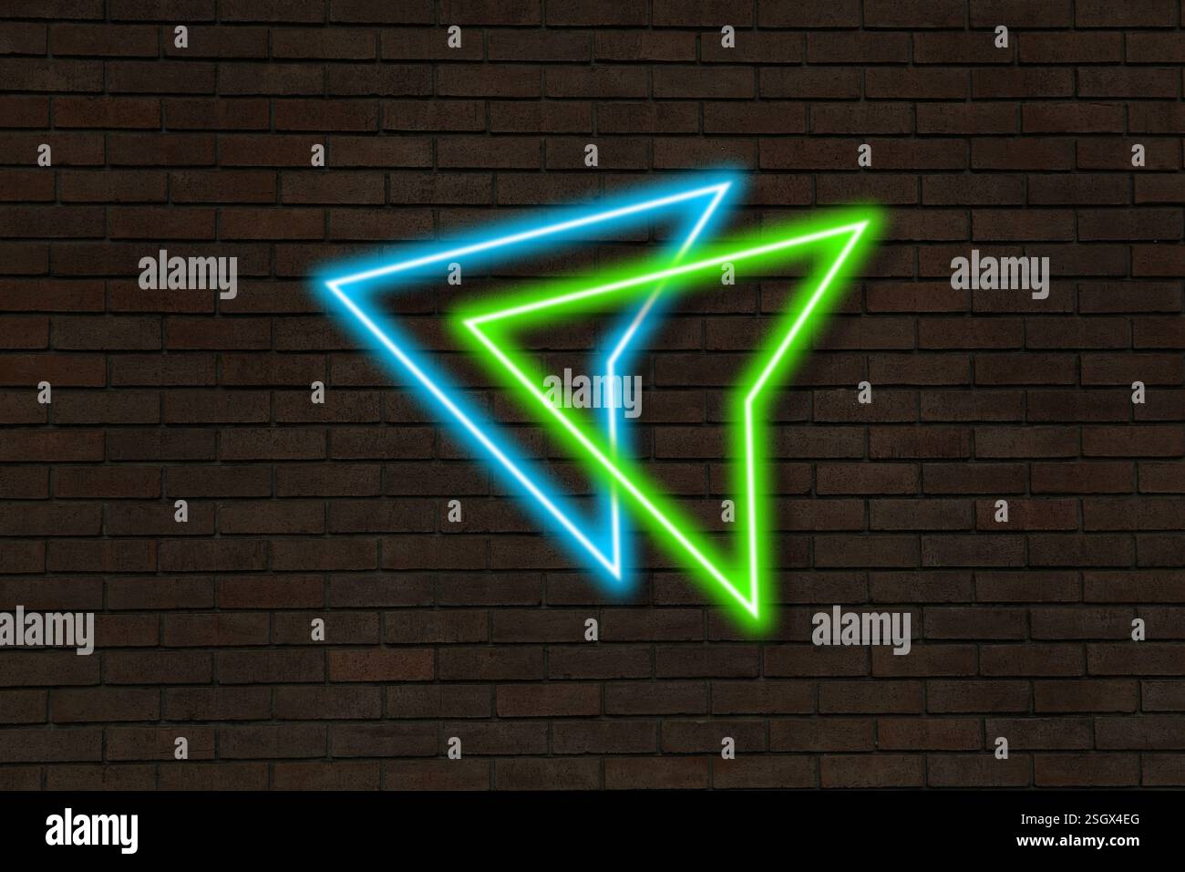 Bright neon arrow-shaped pointer on brick wall Stock Photo