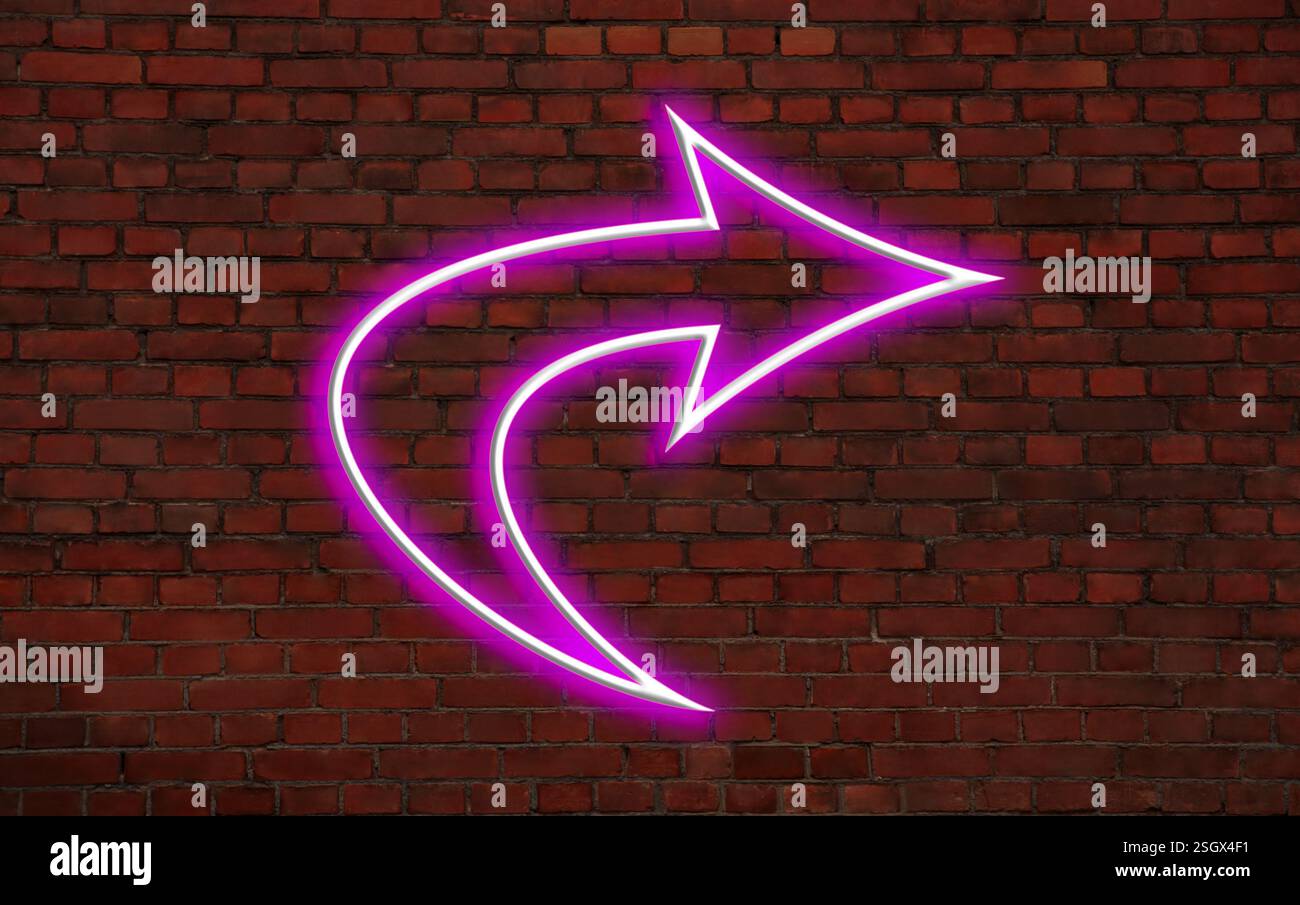 Pink neon arrow-shaped pointer on brick wall Stock Photo