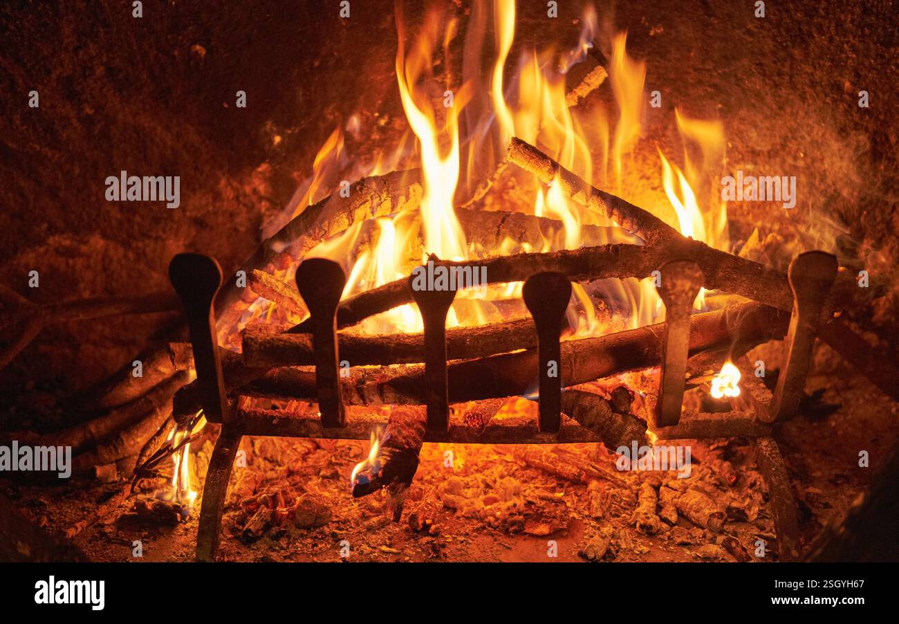 firewood burning in a fireplace Stock Photo - Alamy