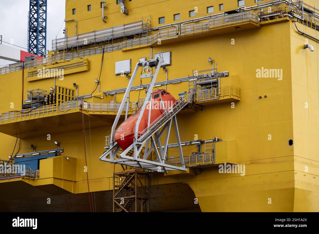 Close up of a life raft, clinging to the side of an enormous, north sea ...