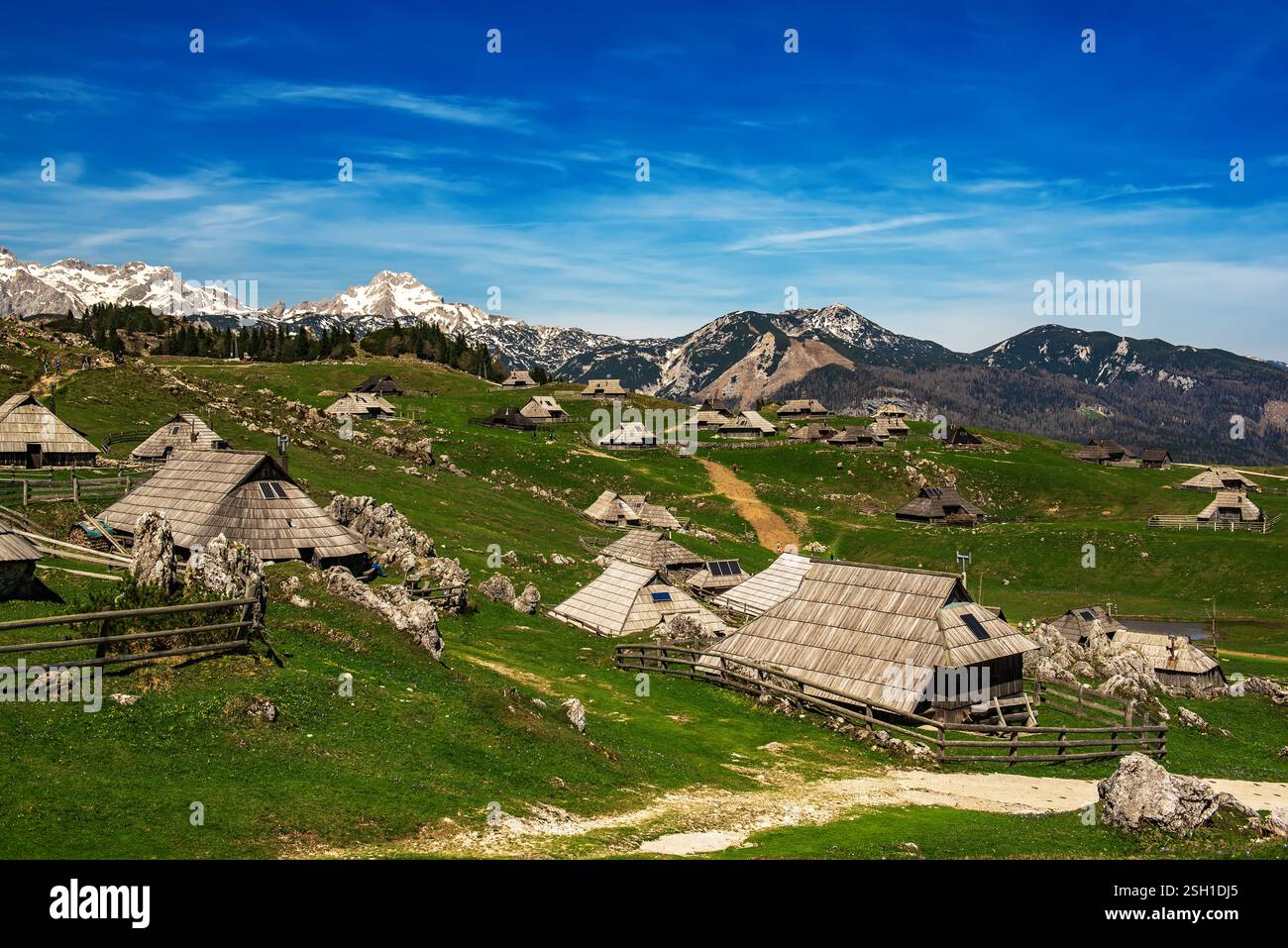 Image showcasing Mountain village in Alps, wooden houses in traditional style, Velika ...