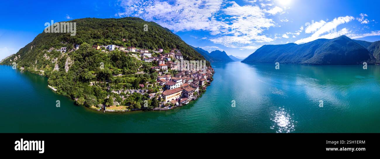 most beautiful traditional villages of Switzerland - scenic Gandria with colorful houses in lake Lugano . Border with Italy. Aerial drone panoramic vi Stock Photo