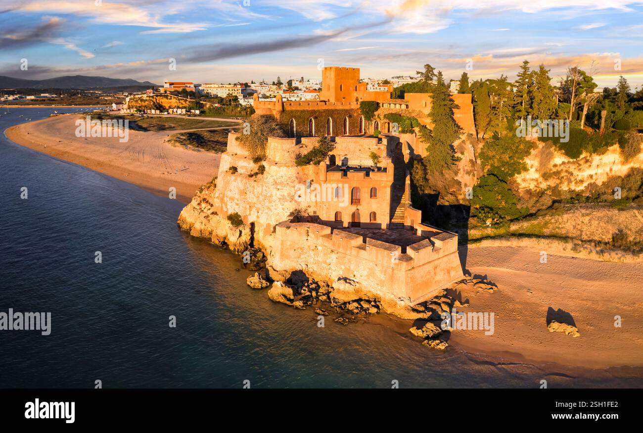 Portugal scenic places. Beach and castle Sao Joao do Arade in Ferragudo fishing village in the Algarve .  sunset scenery Stock Photo