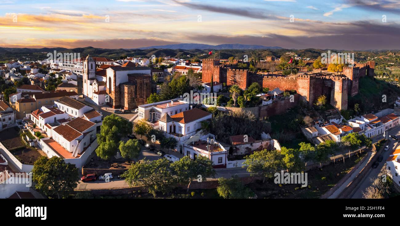 Portugal travel and landmarks. Historic town Silves with well preserved castle, former capital of Algarve. aerial high angle view Stock Photo