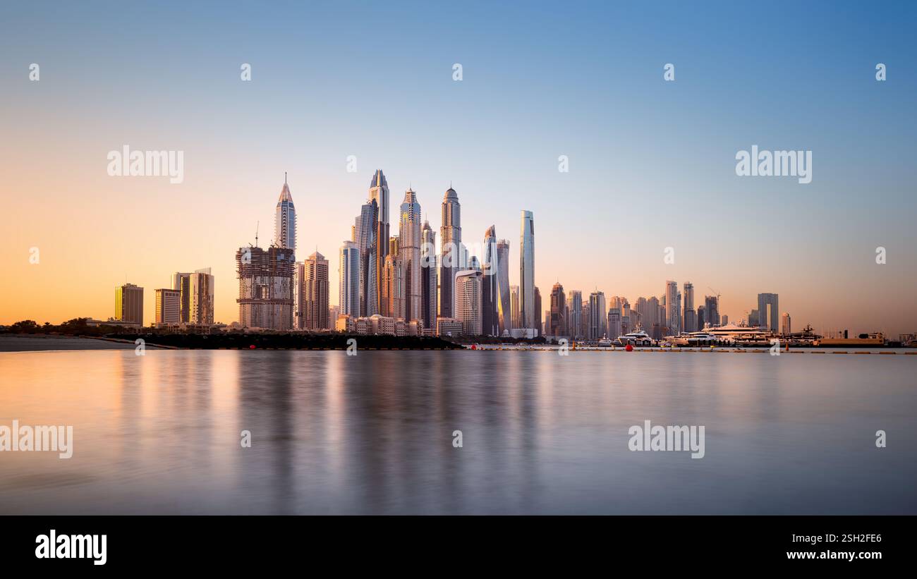 the skyscrapers of jumeirah beach during sunrise, dubai Stock Photo