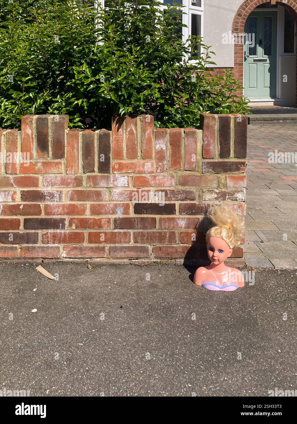 Girl's World-style head outside a house - Smartphone Captured Stock Image