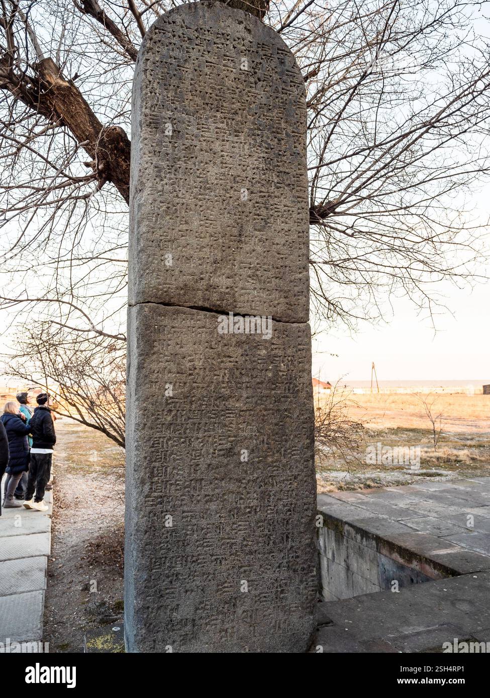 Zvartnots, Armenia - January 25, 2025: urartian king Russa II cuneiform inscription on stele in Armenian Zvartnots Cathedral in winter evening Stock Photo