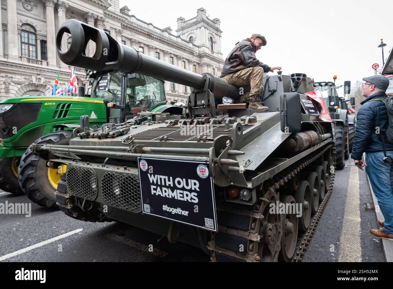 London, UK. 10 February, 2025. A tank joins farmers filling Whitehall and surrounding streets with hundreds of tractors during their third protest against the changes to agricultural inheritance tax announced by chancellor Rachel Reeves in the October 2024 budget. The event, organised by 'Save British Farming' and 'Fairness for Farmers', took place ahead of MPs debating a petition in Parliament calling for agricultural land to remain exempt from inheritance tax. Credit: Ron Fassbender/Alamy Live News Stock Photo
