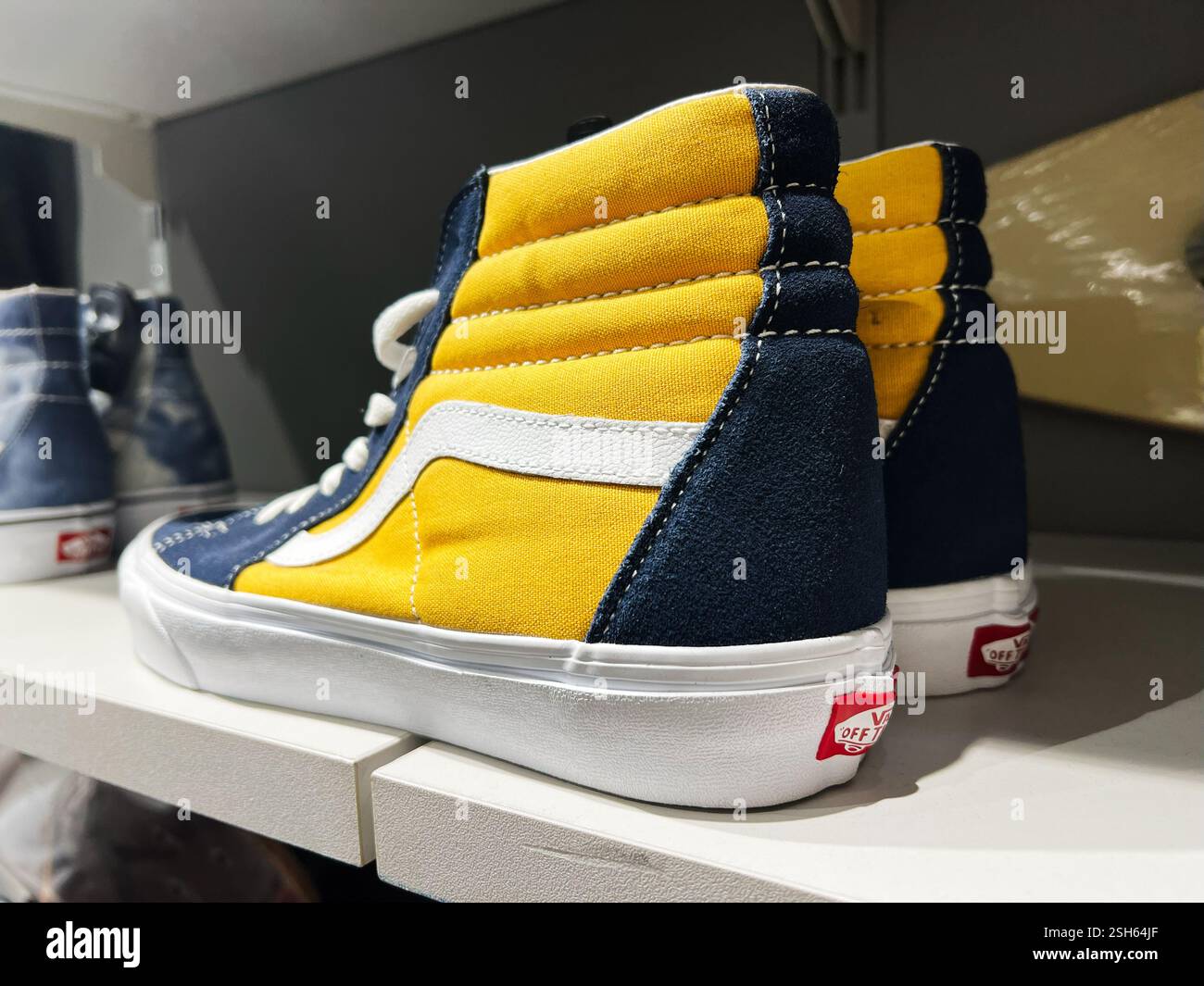 blue and yellow high top vans