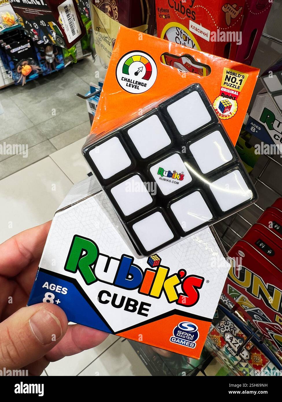 Kyiv, Ukraine - February 09, 2025: Hand holding Rubik's Cube box ...